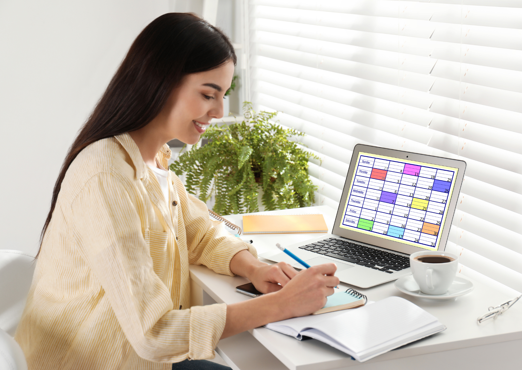 Woman scheduling a hearing aid consultation on her laptop.